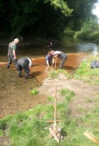 North West Kent Countryside Partnership  and thames21 volunteers work on river habitat enhancements at Foots Cray Meadows.