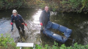 Chris Rose and Michael Heath after 'catching' the sofa. It doesn't look big, but all the stuffing had soaked up lots of water, so it was extremely heavy. (Photo: Ron Pearson)