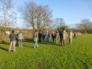 Attendees, sevaral ofwhom has never been to Crayford Rough before,  enjoy bird-watching in the winter sun. (Photo: Brenda Todd)