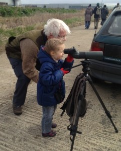 Next Generation - Ralph Todd shows a young birdwatcher how to use a telescope. (Photo: Karen Sutton) 