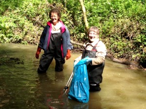 FoTS team members fishing rubbish out of the Shuttle in Bexley Park Woods. 