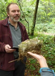 Bexley bird box supremo Duncan Devine examines a BlueTit nest from a Bexley Woods nest box. (Photo: Ralph Todd)